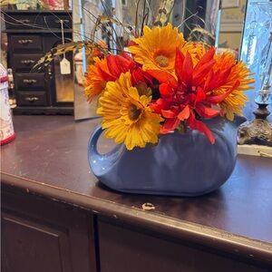 Vibrant Faux Floral Arrangement in Blue Ceramic Vase
